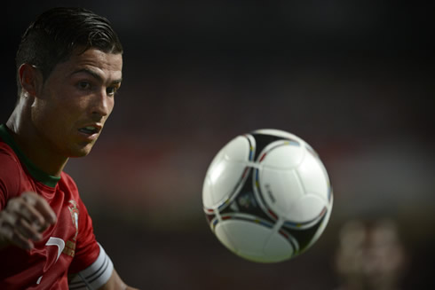 Cristiano Ronaldo chasing the ball during a game for Portugal, before the EURO 2012 debut