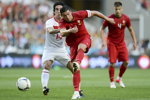 Cristiano Ronaldo in action for Portugal, shooting the ball with his left foot, in 2012