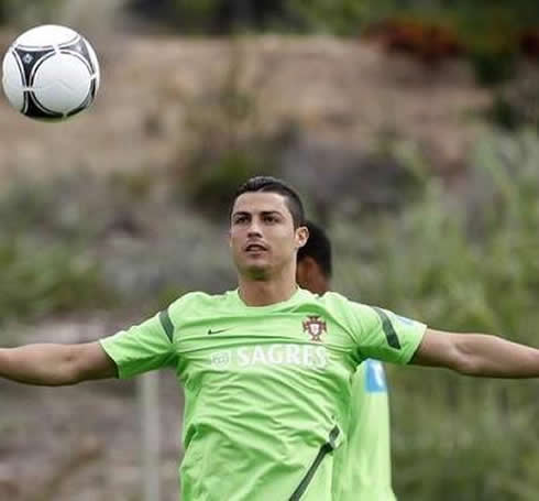 Cristiano Ronaldo with arms stretched to control a ball in Portugal training, before the EURO 2012 starts