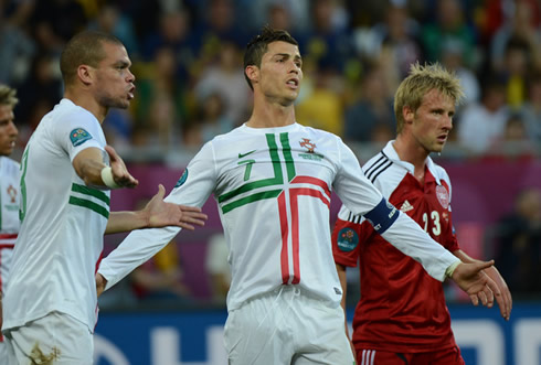 Cristiano Ronaldo and Pepe complaining at something with the referee, in Portugal 3-2 Denmark for the EURO 2012