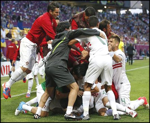 Portuguese team players celebrating the late winning goal against Denmark, in a 3-2 win at the EURO 2012