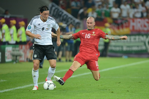 Raúl Meireles tackling Mesut Ozil, in Portugal vs Germany for the EURO 2012