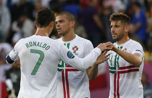 Cristiano Ronaldo with Pepe and Miguel Veloso, in the EURO 2012