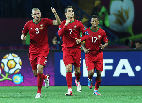 Pepe and Nani running back, after Portugal goal celebrations against Holland, in the EURO 2012