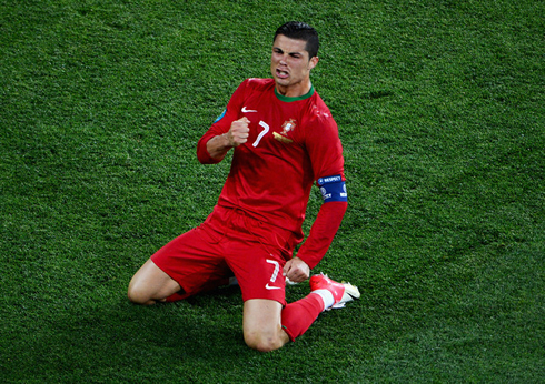 Cristiano Ronaldo sliding on his knees and celebrating goal for Portugal with passion, at the EURO 2012