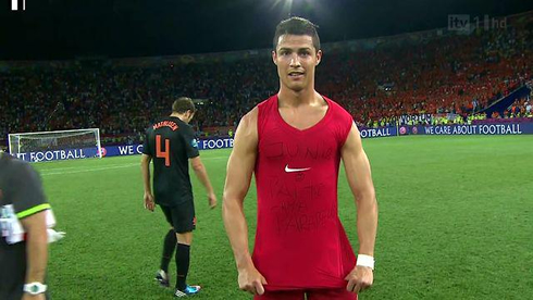 Cristiano Ronaldo showing his sleeveless shirt, where he wrote a message to dedicate to his son, Junior, at the EURO 2012