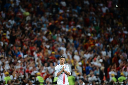 Cristiano Ronaldo praying during the penalty kicks between Portugal and Spain, in the EURO 2012