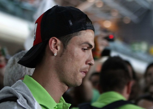 Cristiano Ronaldo wearing a cap and arriving at the airport, after the EURO 2012 campaign for Portugal