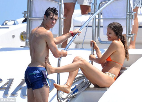 Cristiano Ronaldo being kicked by Irina Shayk, as he climbs the stairs from his yacht, in St Tropez 2012
