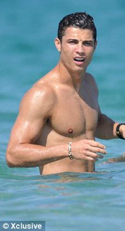 Cristiano Ronaldo gets surprised on the water and looks aside, in 2012