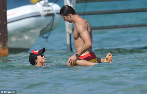 Cristiano Ronaldo holding Irina Shayk under water, as she wraps her legs around him in Saint Tropez, Summer of 2012