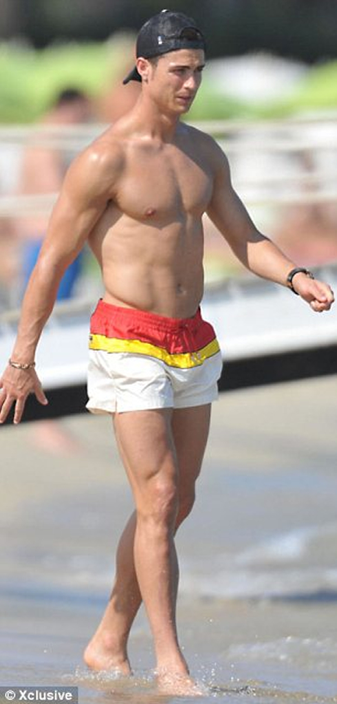 Cristiano Ronaldo top form body and shape, as he walks around on the beach with his tight shorts, showing off his six pack abs and chest muscles, in 2012 Summer