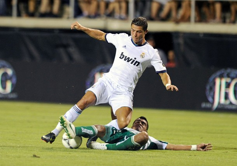 Cristiano Ronaldo being tackled from behind, in Real Madrid 2012-2013 pre-season