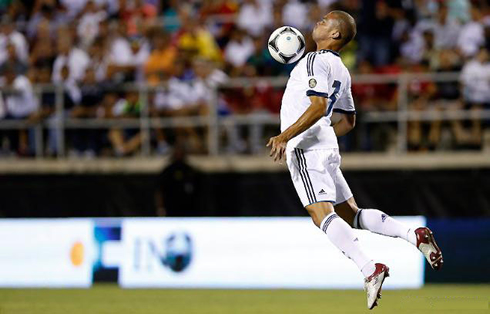 Pepe controlling the ball on his chest while in the air, during a Real Madrid pre-season game in 2012-2013