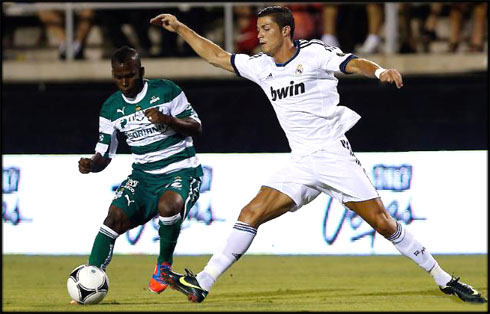 Cristiano Ronaldo stretching to reach the ball, in pre-season friendly for Real Madrid, in 2012-2013