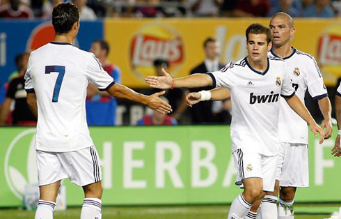 Cristiano Ronaldo greeting Nacho and Pepe, after scoring his first goal of the 2012-2013 season for Real Madrid