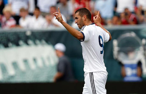 Karim Benzema celebrating a goal for Real Madrid, with a new look, darker skin and grown hair, in 2012-2013