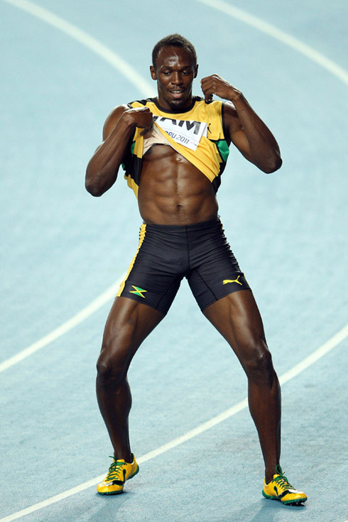 Bolt dancing, as he takes off his shirt and shows his sexy six pack abs