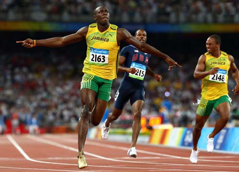 Usain Bolt disrespecting his opponents and celebrating before he finishes the 100m, at the 2008 Beijing Olympics