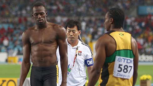 Usain Bolt shirtless and half naked, showing his abdominals, chest and arm muscles, in 2011-2012