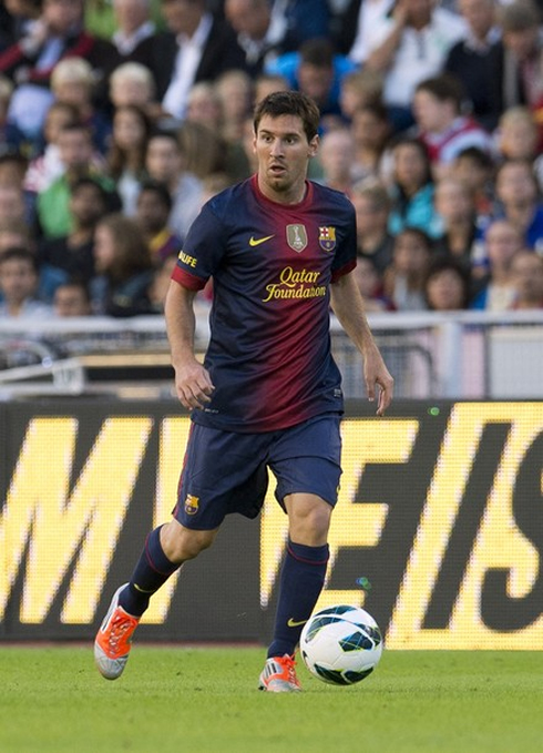 Lionel Messi in action for Barcelona in 2012-2013, wearing the new jersey, kit and shirt