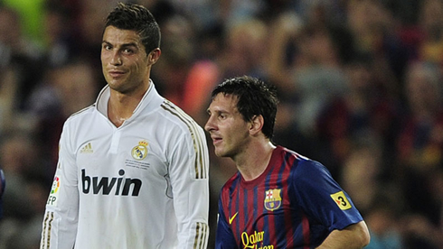 Cristiano Ronaldo making a funny face as Lionel Messi passes by him, in Real Madrid vs Barcelona