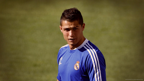 Cristiano Ronaldo in a blue shirt at a Real Madrid training session in 2012-2013
