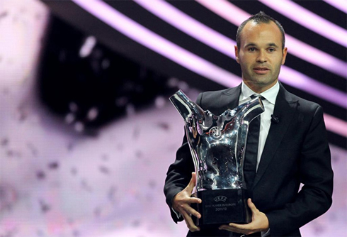 Andrés Iniesta holding the UEFA Best Player in Europe 2011-2012 award