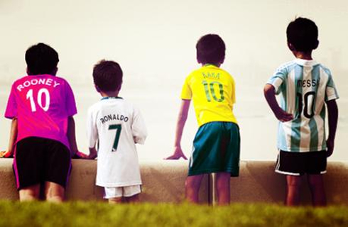 Football wallpaper with kids wearing Rooney, Ronaldo, Kaká and Lionel Messi's shirts and jerseys