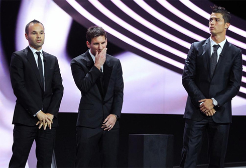 Cristiano Ronaldo looking uncomfortable, next to Lionel Messi and Andrés Iniesta, at the UEFA gala awards ceremony for the Best Player in Europe in 2012