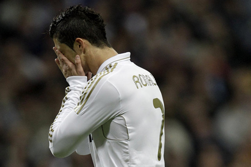 Cristiano Ronaldo hiding his face and crying in a Real Madrid game in 2012