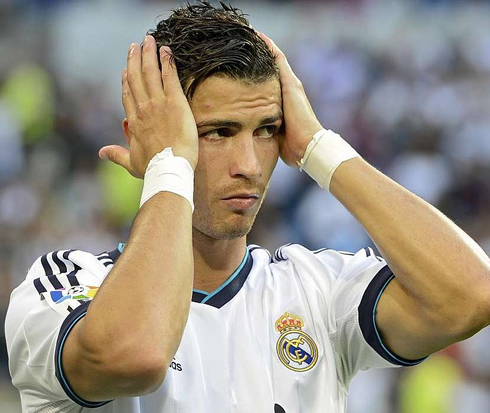 Cristiano Ronaldo putting gel on his hair, during a Real Madrid match in 2012