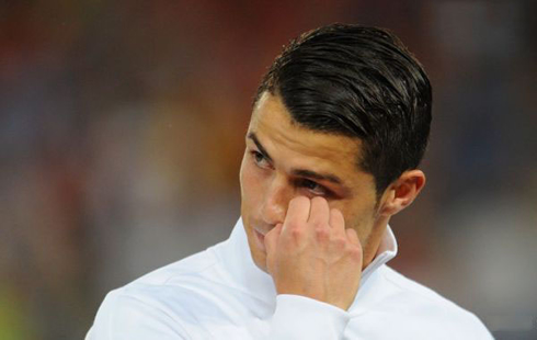 Cristiano Ronaldo wiping tears from his face, in 2012