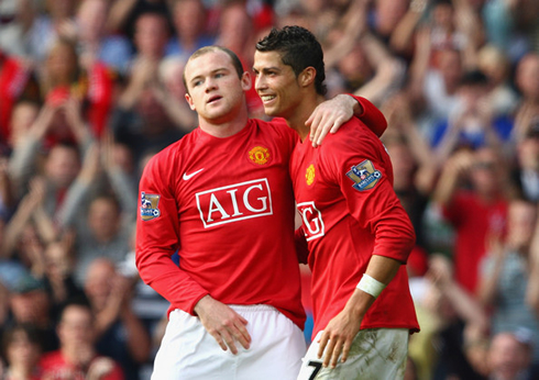 Wayne Rooney hugging Cristiano Ronaldo, in a Manchester United goal celebration