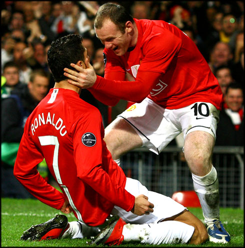 Cristiano Ronaldo on his knees, celebrating goal with Wayne Rooney, in Manchester United 2008-2009
