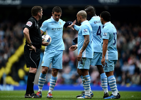 Kolarov fighting with Mario Balotelli, when deciding who takes a free-kick in Manchester City