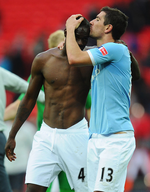 Kolarov gay kiss to Mario Balotelli's bald head, in Manchester City