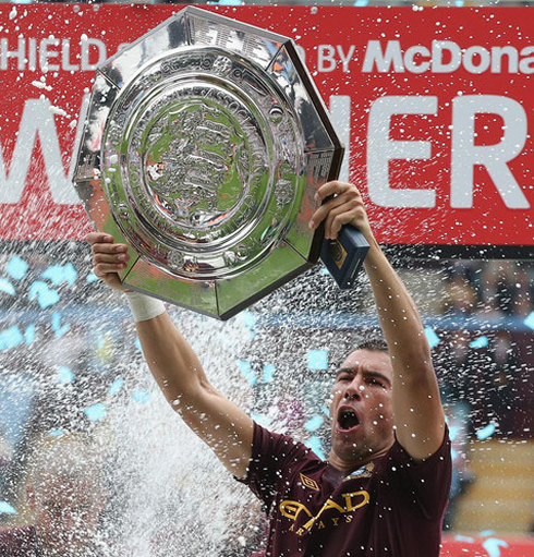 Kolarov lifting the English Premier League trophy for Manchester City, in 2012