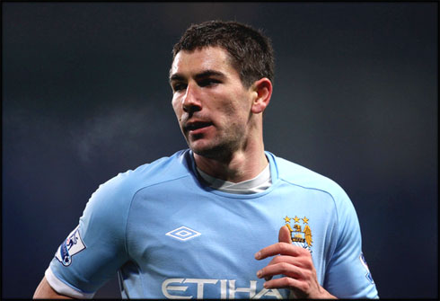 Kolarov playing for Manchester City, in 2012-2013