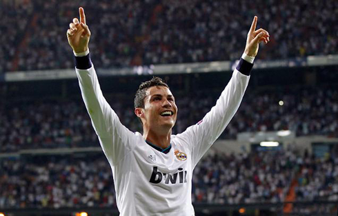 Cristiano Ronaldo raising his two hands in the air, to celebrate Real Madrid winning goal against Manchester City, in the UEFA Champions League 2012-2013