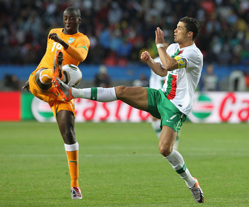 Yaya Touré fighting for the ball with Cristiano Ronaldo, in a 2010 World Cup game between Portugal and Ivory Coast