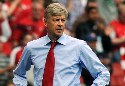 Arsene Wenger wearing a blue shirt and a red tie, during an EPL game for Arsenal