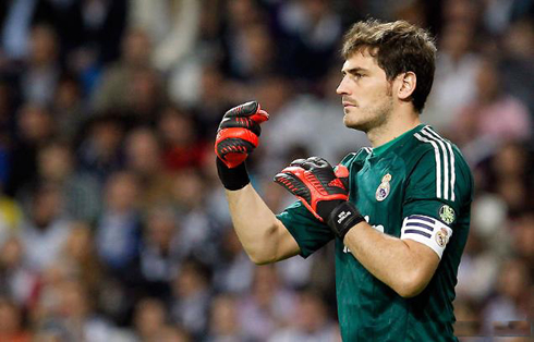 Iker Casillas in Real Madrid, wearing a green shirt, jersey and uniform kit, in 2012-2013