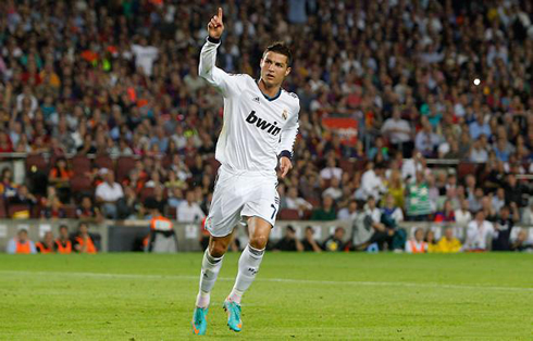 Cristiano Ronaldo puts his finger in the air and celebrates Real Madrid goal vs Barcelona in 2012-2013