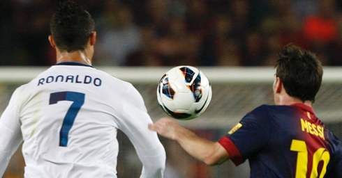 Cristiano Ronaldo and Lionel Messi chasing the same ball in La Liga's Clasico, in 2012-2013