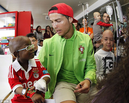 Cristiano Ronaldo doing charity work in Portugal, with sick children and kids