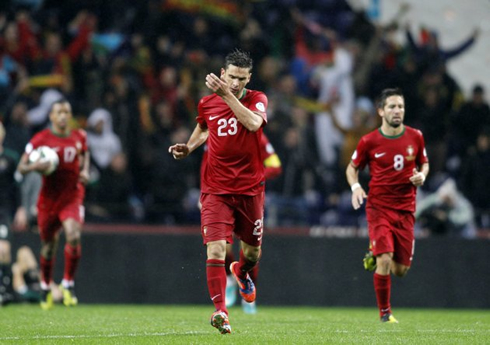 Hélder Postiga celebrating Portugal goal against Northern Ireland, as he heads back to his half, with João Moutinho and Nani coming behind him, in 2012-2013