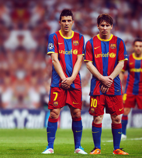 Lionel Messi and David Villa protecting their low parts like little girls, before a free-kick