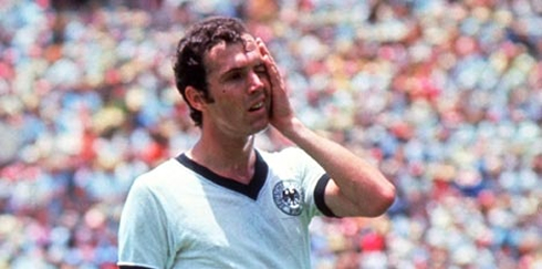 Franz Beckenbauer covering his face with his own hand, in a game for Germany/Deutschland