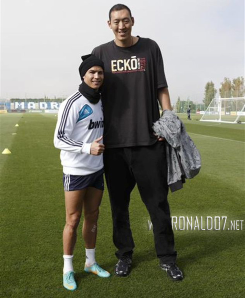 Cristiano Ronaldo taking a photo with the tallest man on Earth, a Chinese basketball player called Sun Mingming, from China Beijing Ducks